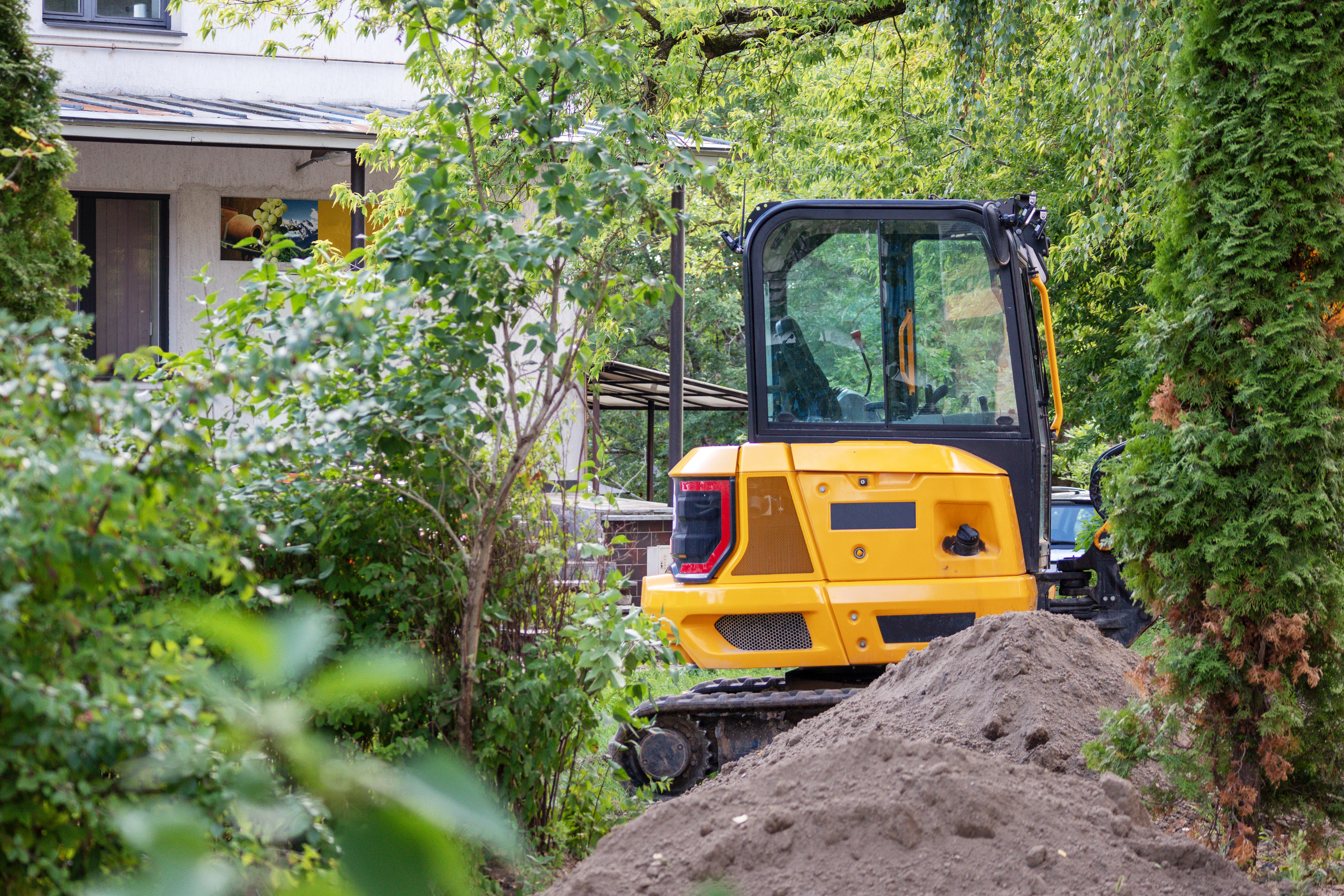 Bulldozer is being used build home